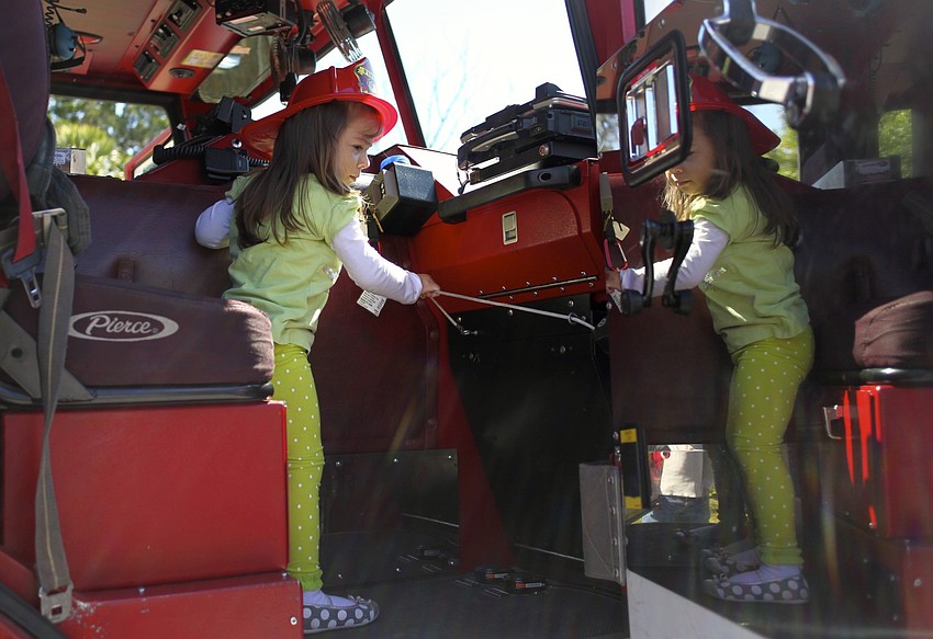 Zuleika Zunz rings the bell on the fire truck.