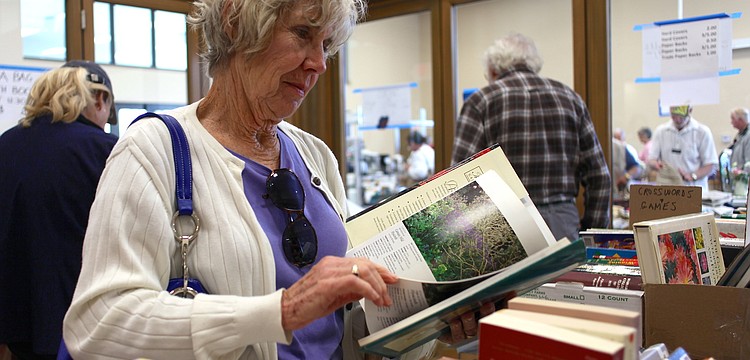 Barbara Hotchkiss browses through the books at the Sale Away.