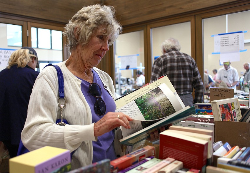 Barbara Hotchkiss browses through the books at the Sale Away.