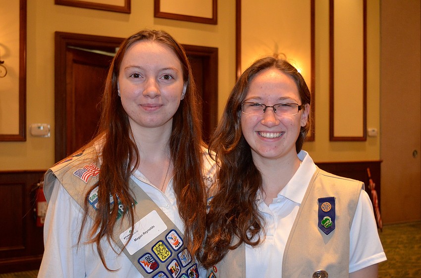 Seventeen-year-olds Megan Reynolds and Emily Sisk sport their Girl Scout vests.