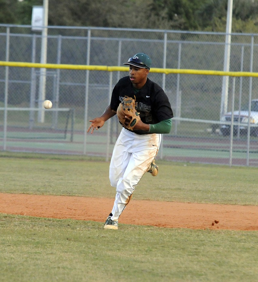 Cameron Pearcey flips the ball back to the mound after securing the final out in the bottom of the first inning.