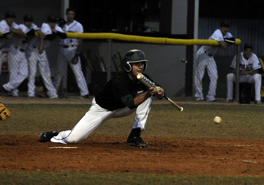 Lakewood Ranchâ€™s Andrew Giddens puts down a bunt to advance a runner in the top of the third inning.