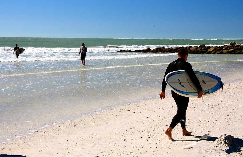 Surfers at Lido Beach.