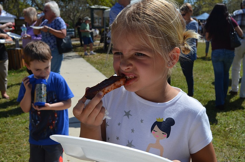 Tegan Hoffman bites into a rib.