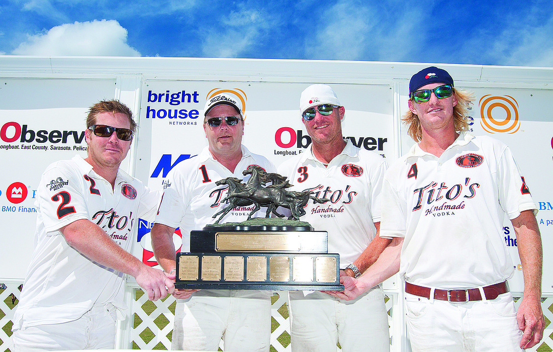 Courtesy photo Team Tito's holds the Schroeder-Manatee Ranch trophy after defeating Wildcat in the 12-goal finals March 16.