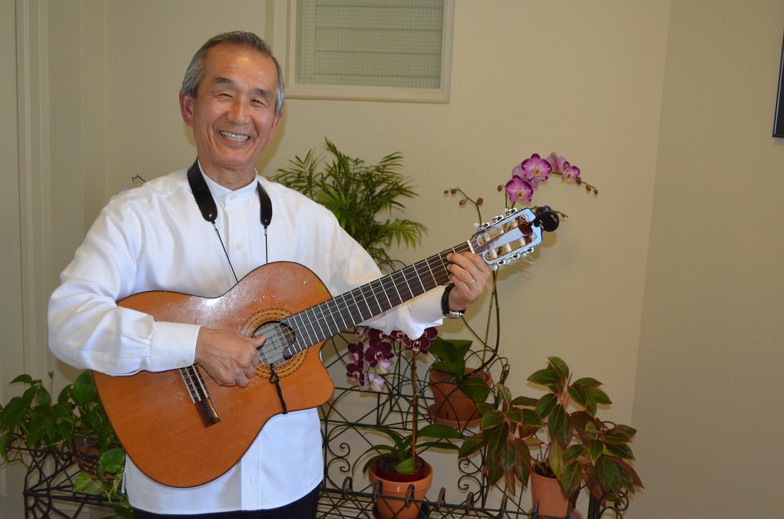 Yusuke Horiguchi performs on a requinto guitar, which is tuned higher than a regular guitar to allow the lead guitarist to play a beautiful introduction to a song. (Robin Hartill)
