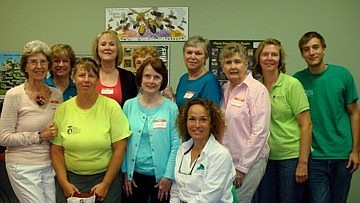Courtesy photosThe University Park Women's Club Garden Group members are pictured with Tammy Kovar, front, of Biological Tree Services, following a presentation.