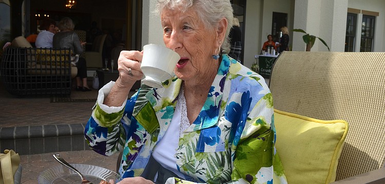 Phyllis Clifford sips on a cup of tea.
