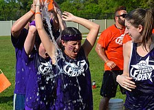 Lauren Hayes gets doused in cold water during an event.