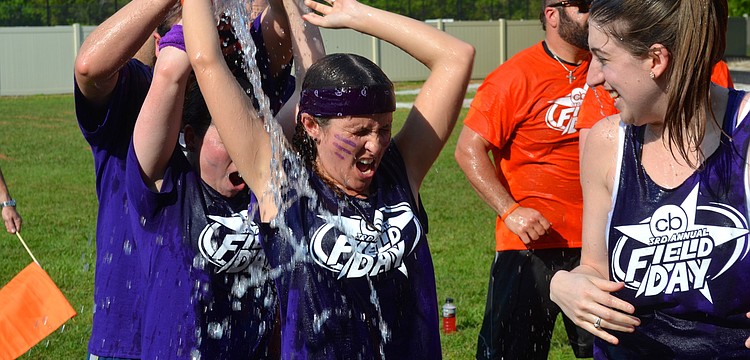 Lauren Hayes gets doused in cold water during an event.