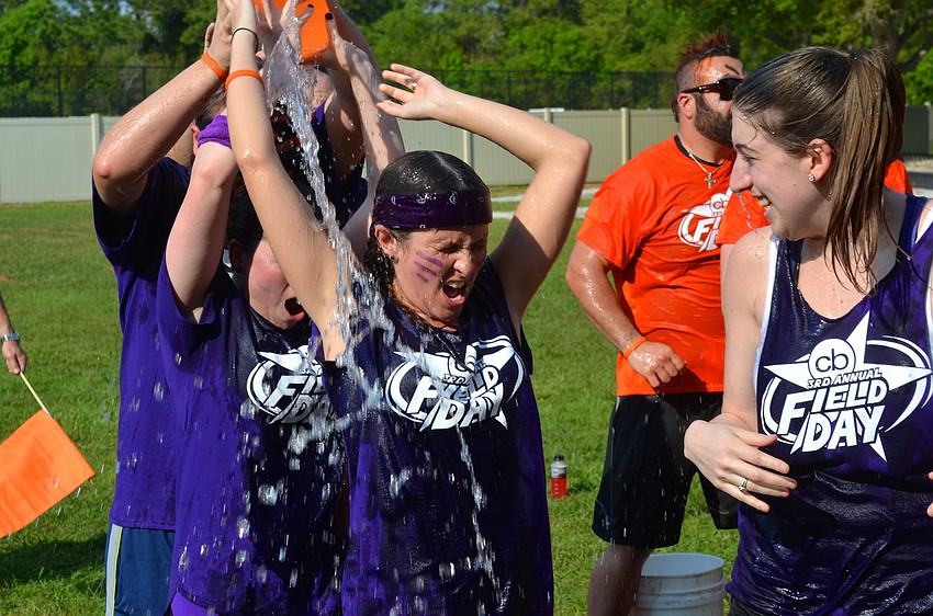 Lauren Hayes gets doused in cold water during an event.