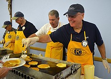 Joe Walsh serves up pancakes with a smile.