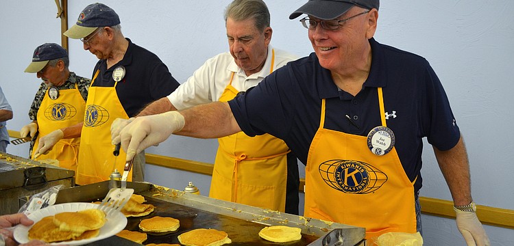 Joe Walsh serves up pancakes with a smile.