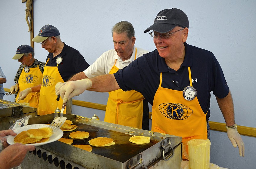 Joe Walsh serves up pancakes with a smile.