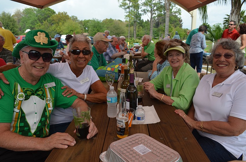 Tom Hall, Carol Hayes, Marilyn Hall and Joan Sacco dressed in green.