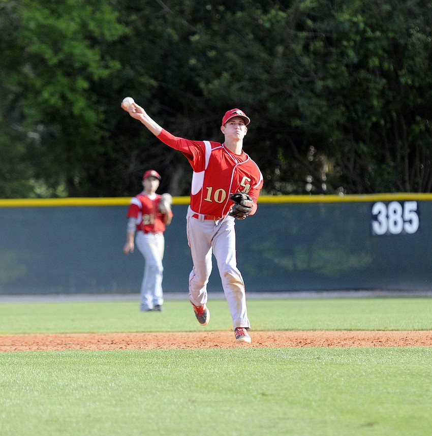 Cardinal Mooney shortstop Taylor Garris fields a routine ground ball and throws it back to first base.