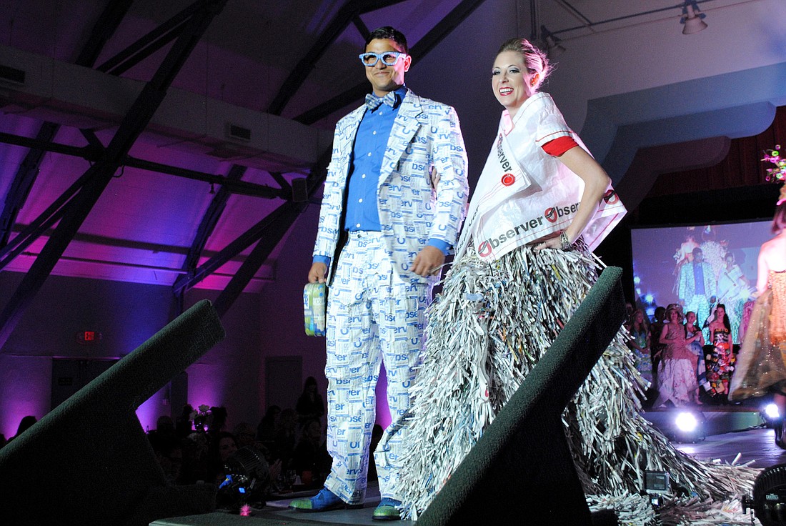 Observer Media Group's Alex Mahadevan and Leslie Gnaegy modeling in the iconcept fashion show.