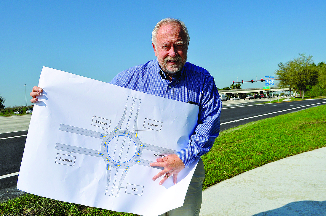 SMR President and CEO Rex Jensen shows his proposed roundabout design for Interstate 75. Photo by Pam Eubanks.