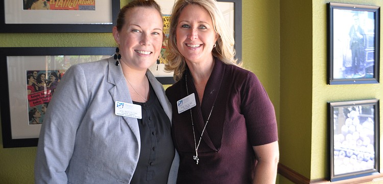 Jen Bartolone and Kim Dalglish, of the Manatee Chamber, register attendees.