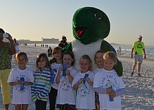 Daisy Troop 304 show off their blue ribbons after the 1-Mile Fun Run.