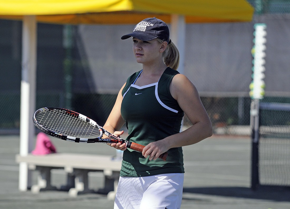 Sophomore Jessie Kroupa prepares for her first singles match of the Class 3A-District 10 tournament April 1.