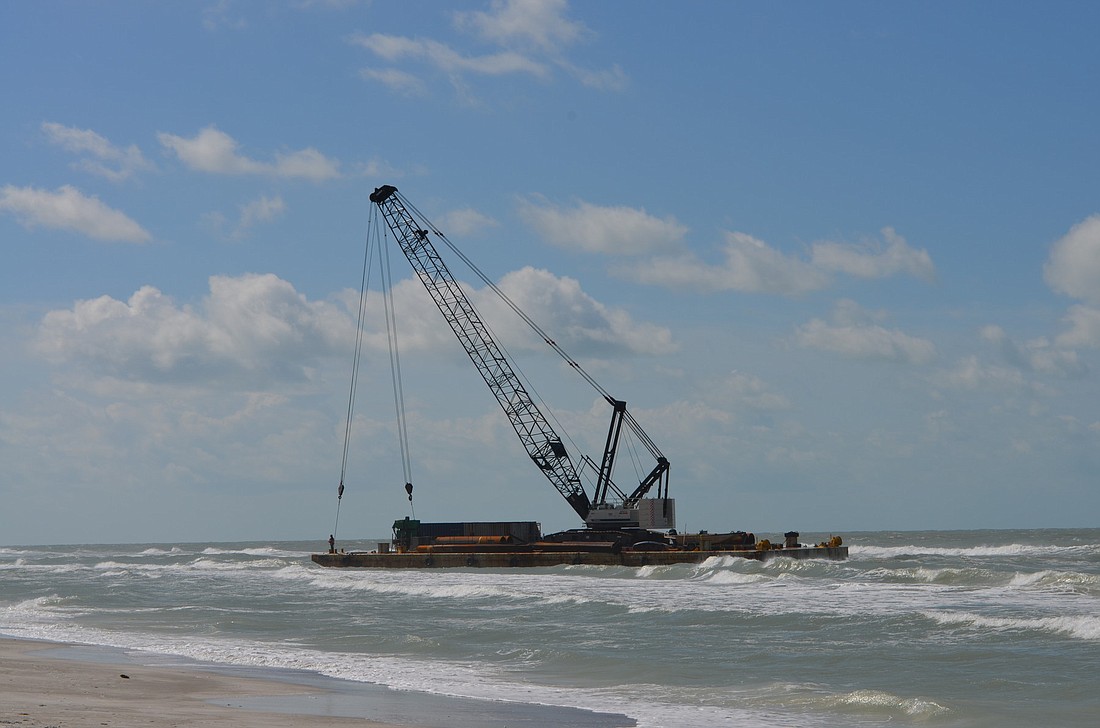 A 130-foot barge ran aground on Longboat Key this morning.