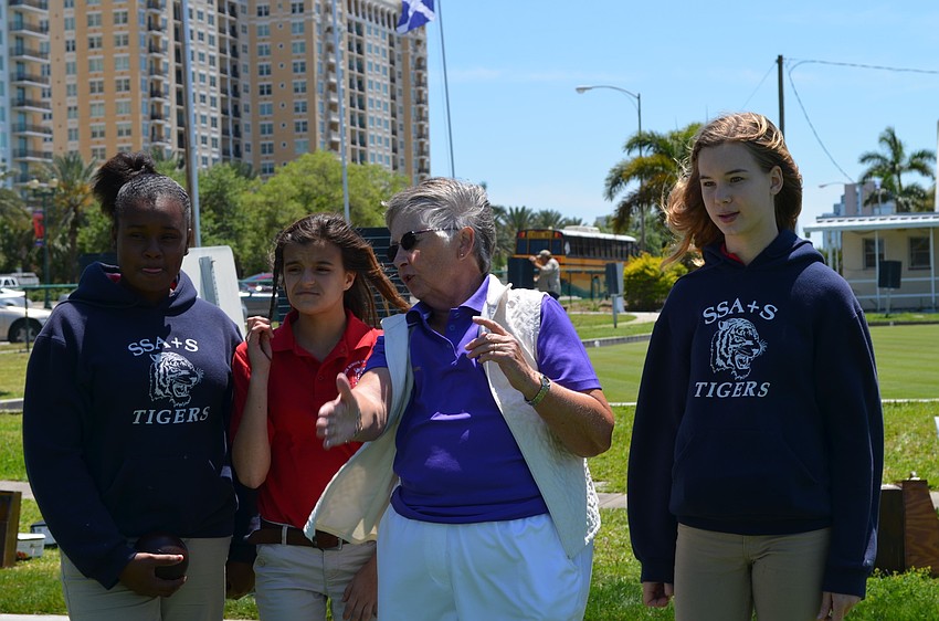 Sharon Farrish (center) helps Destiny Hugine, Kristina Wieder and Baylee Roskamp play.