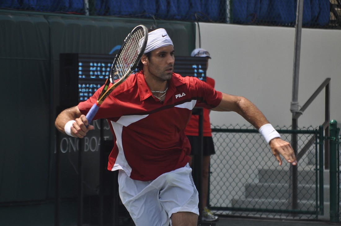 Fritz Wolfmarans raced to make a cross-court forehand against Ilija Bozoljac last year at the Sarasota Open qualifying round. (File photo)
