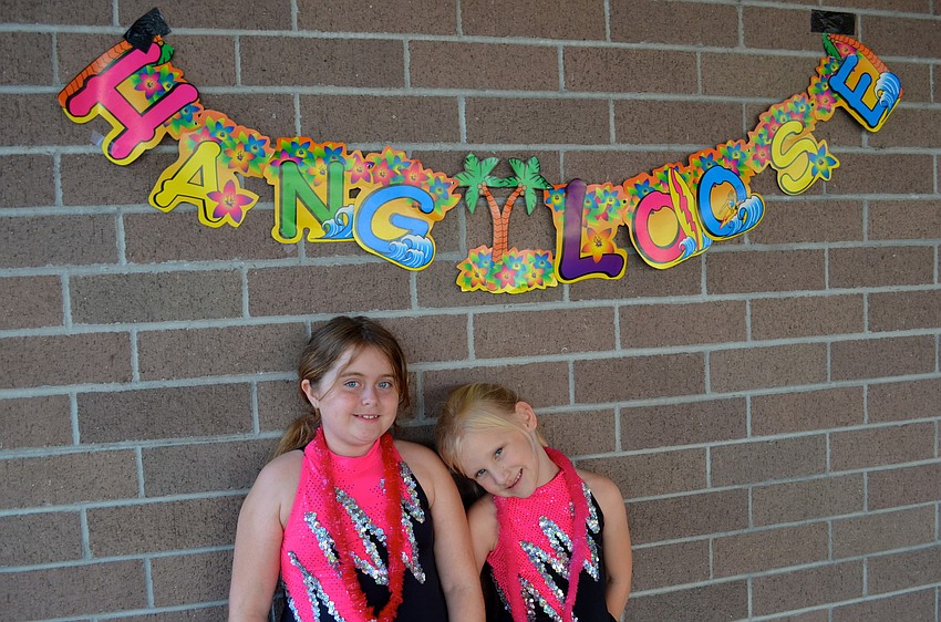 Tara dance team members Tiffany Anderson, 9, and Makenna Bradley, 8, wait to perform