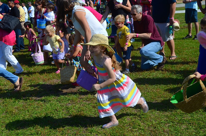 Kinsley Cameron darts toward thousands of Easter eggs.