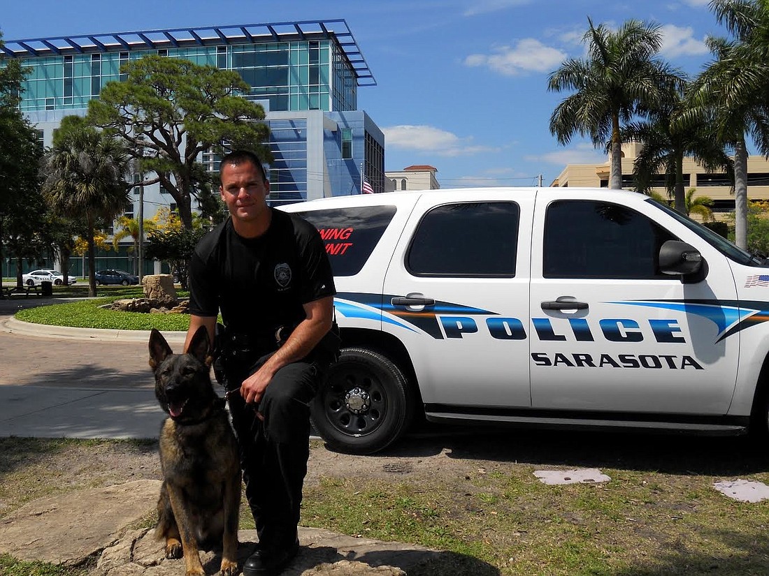 Sarasota Police K9 Andro poses with Officer Nick Dominis.