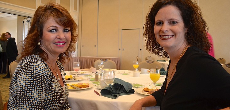 Kiddie Academy owner Marina Wolf-Schmidt and Academy Director Tina Pouso enjoy breakfast.