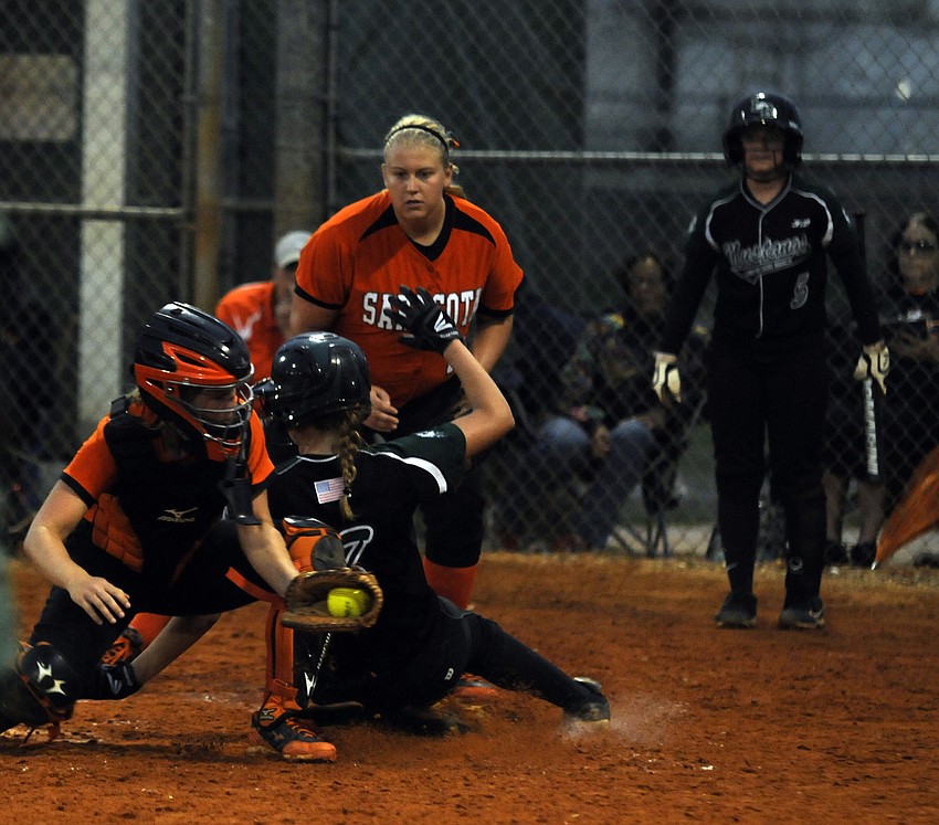 Lakewood Ranch senior first baseman Korrin Cline avoids the tag at home plate to give Lakewood Ranch a 3-0 lead in the bottom of the second inning.