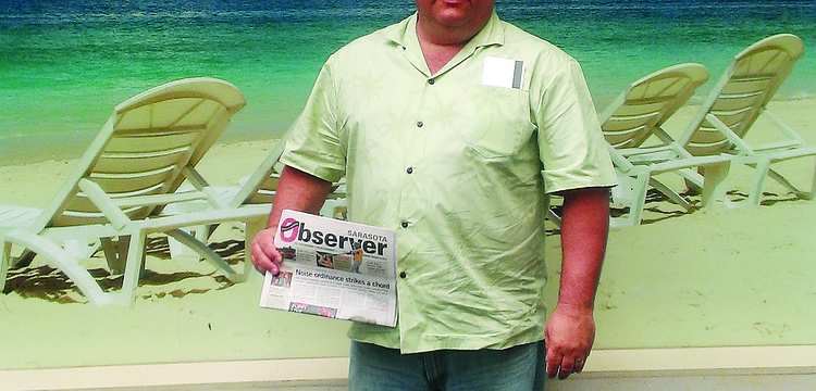 WARM WELCOME. Mark Sortet escaped the cold Chicago winter and enjoyed a five-day stay on Lido Key earlier this year. He learned more about his vacation destination while reading his Sarasota Observer at the Sarasota-Bradenton International Airport.
