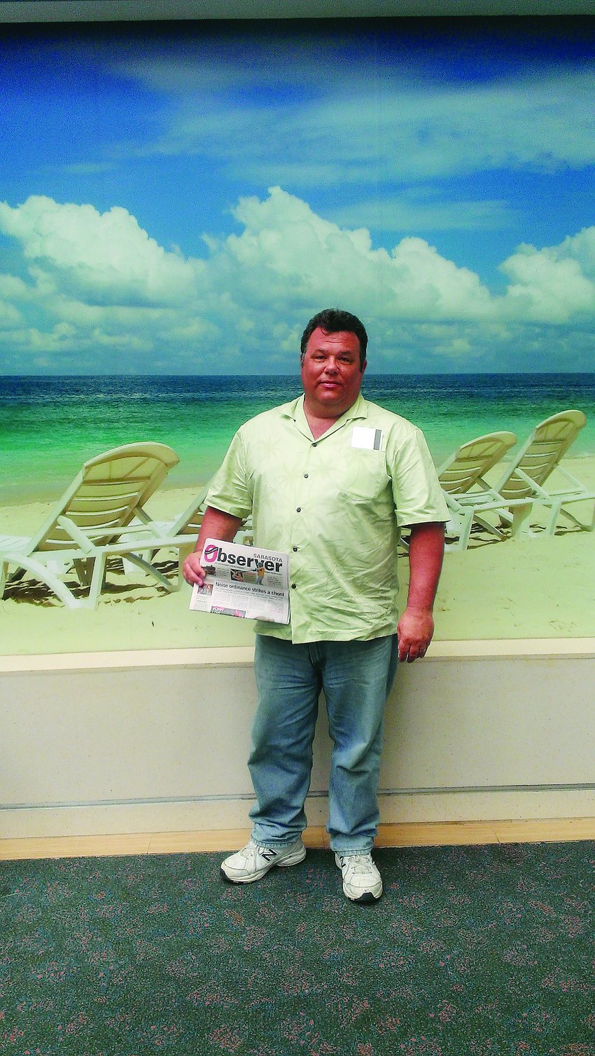 WARM WELCOME. Mark Sortet escaped the cold Chicago winter and enjoyed a five-day stay on Lido Key earlier this year. He learned more about his vacation destination while reading his Sarasota Observer at the Sarasota-Bradenton International Airport.