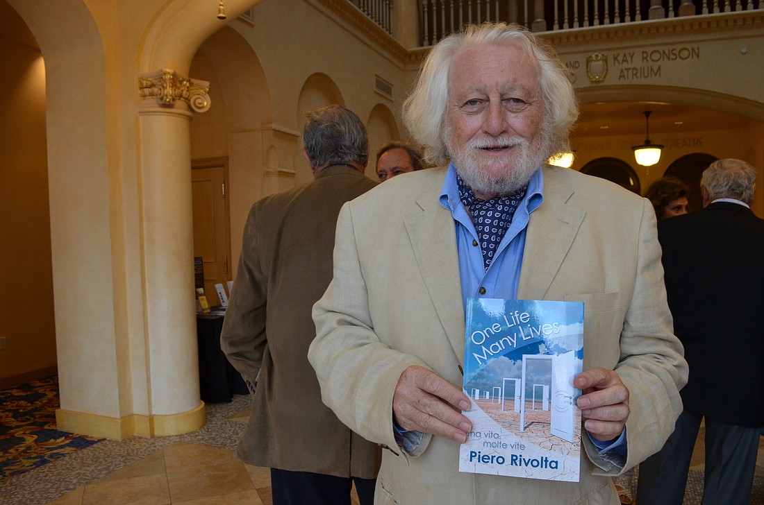 Piero Rivolta with his newest book at its debut.
