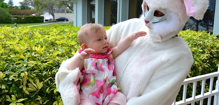 Madeline Carnahan meets the Easter Bunny at Bird Key Yacht Club.