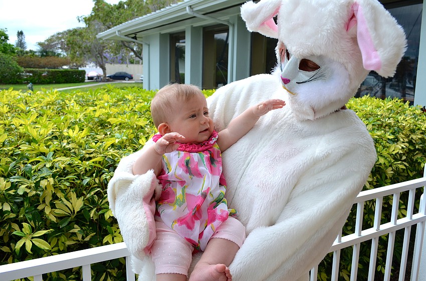 Madeline Carnahan meets the Easter Bunny at Bird Key Yacht Club.