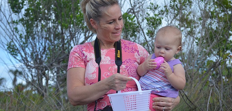 Heidi and Sloane McAllister hunt for eggs.