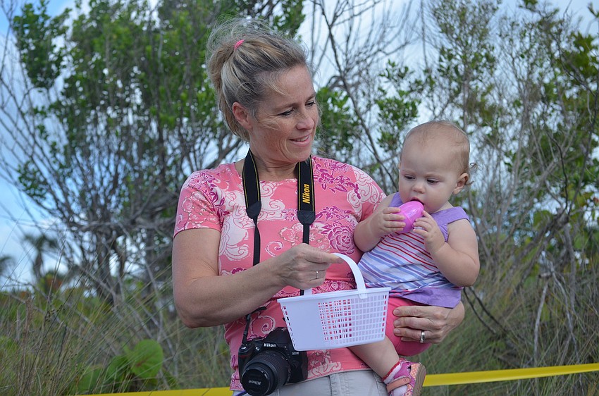 Heidi and Sloane McAllister hunt for eggs.