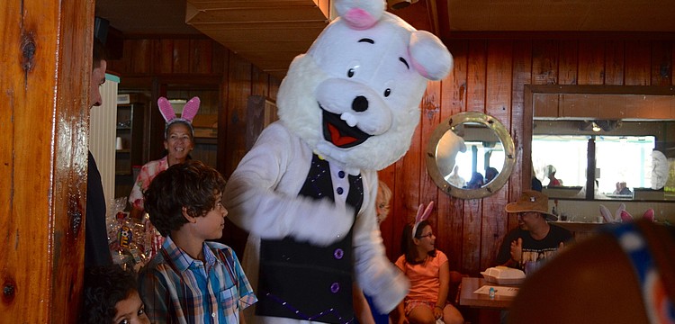 The Easter Bunny dances around Mooreâ€™s Restaurant.