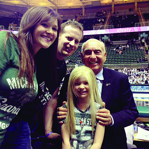 Heather and Matt Hols-worth, with Dick Vitale, and their daughter, Lacey. Courtesy photo