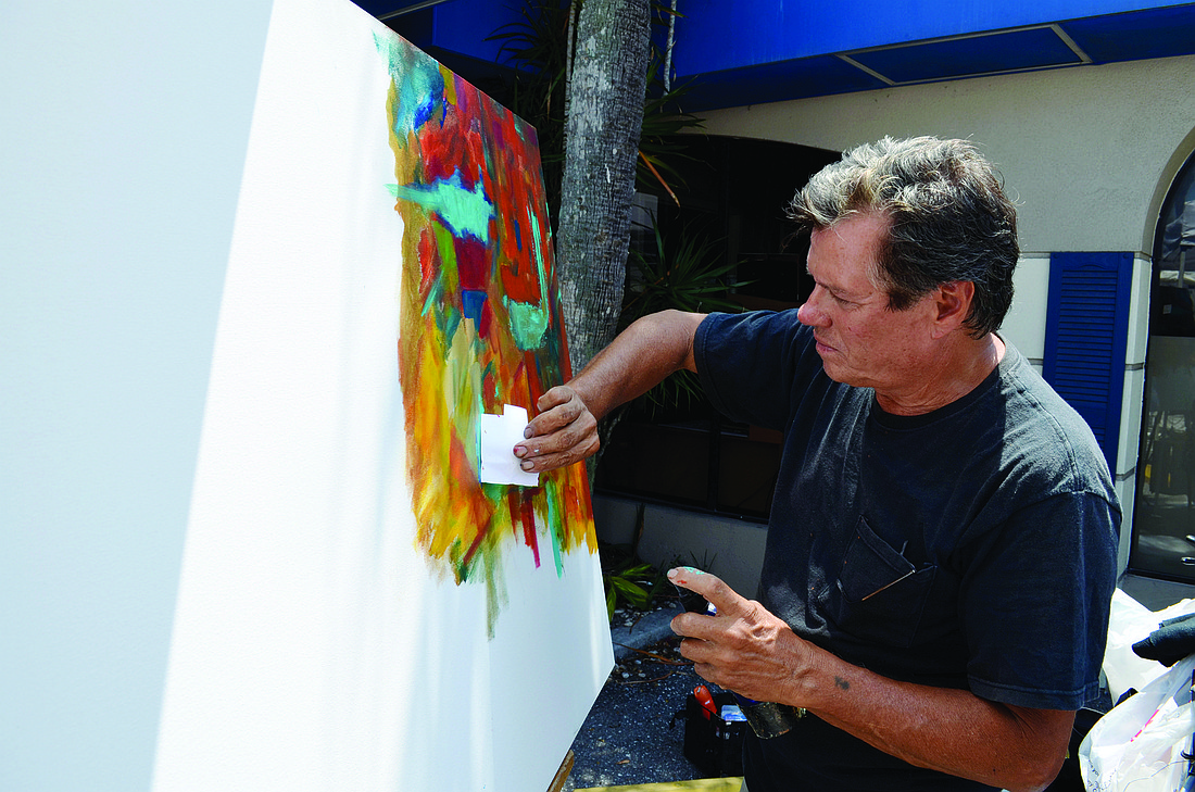 Luis Luis creates a colorful painting during last year's Siesta Fiesta. File photo
