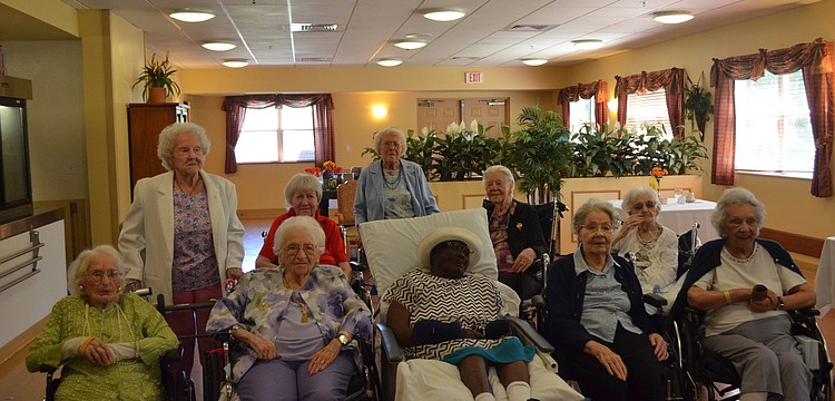 The birthday girls take a group photo.