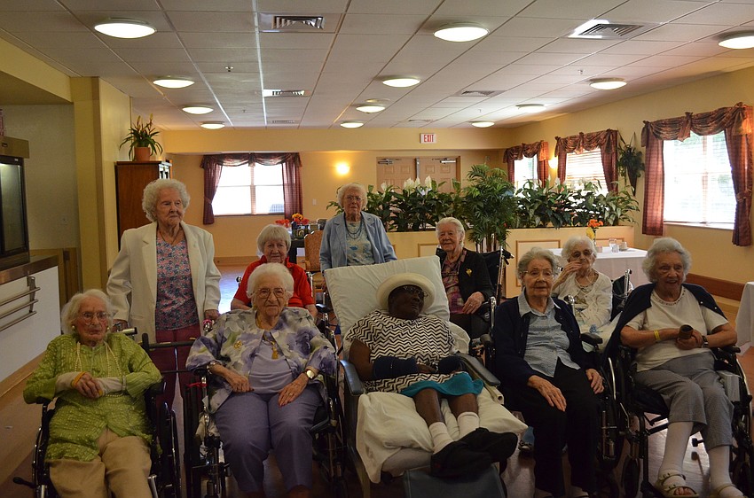 The birthday girls take a group photo.