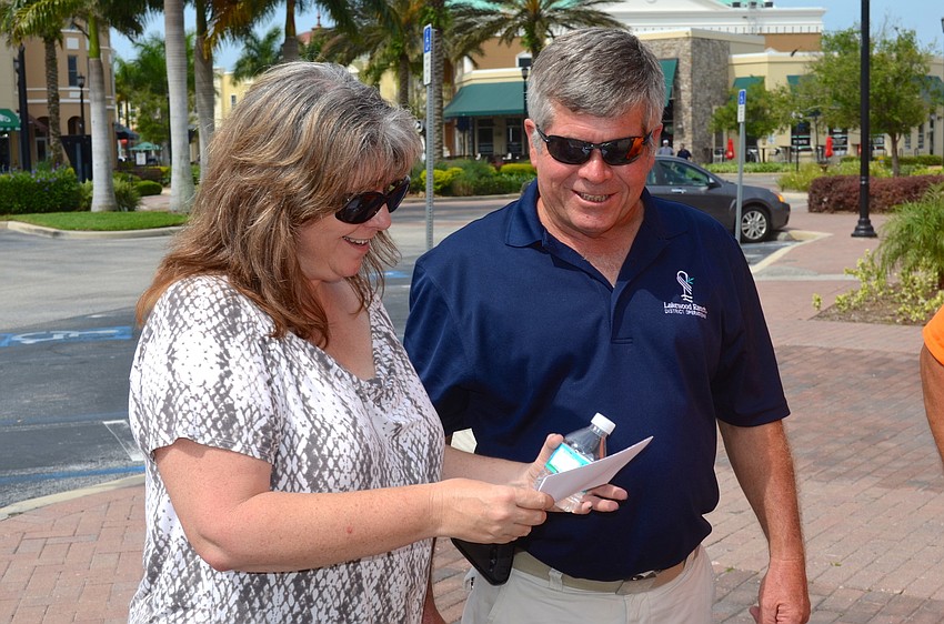 Teresa Alexander and Chuck DeRock try to solve a clue.