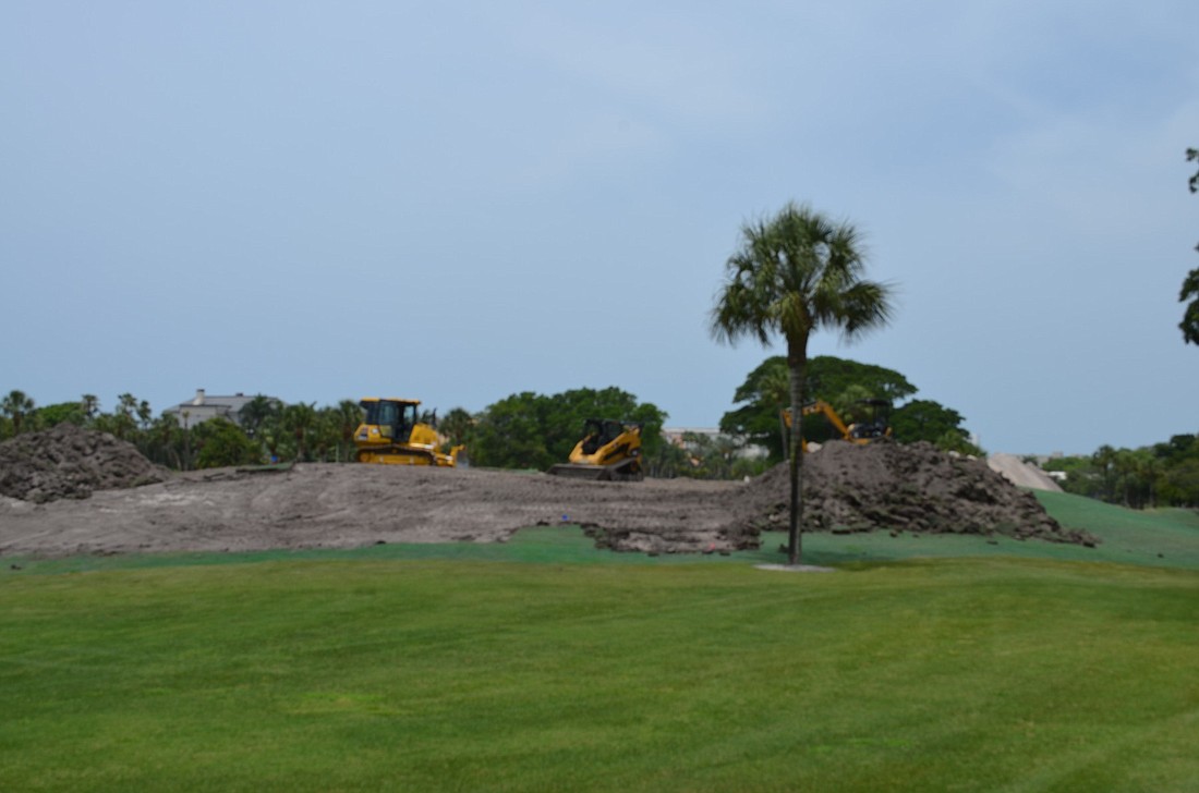Bulldozers and mounds of dirt sit on the Islandside golf course for the scheduled redesign of six greens.