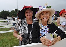 Dawn Standifer and Dee Pelton watch the Parade of Champions demonstration.