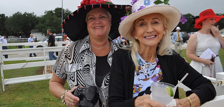 Dawn Standifer and Dee Pelton watch the Parade of Champions demonstration.