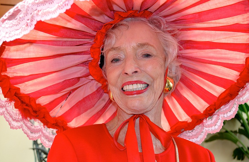 Dorothy Lawrence sports a red, lace hat for the party.